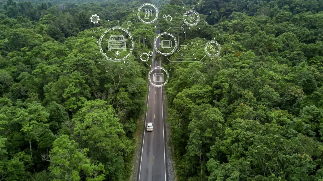 An image showcasing a business professional reviewing sustainability metrics on a computer screen, surrounded by eco-friendly office elements and a cityscape with a green sky in the background.